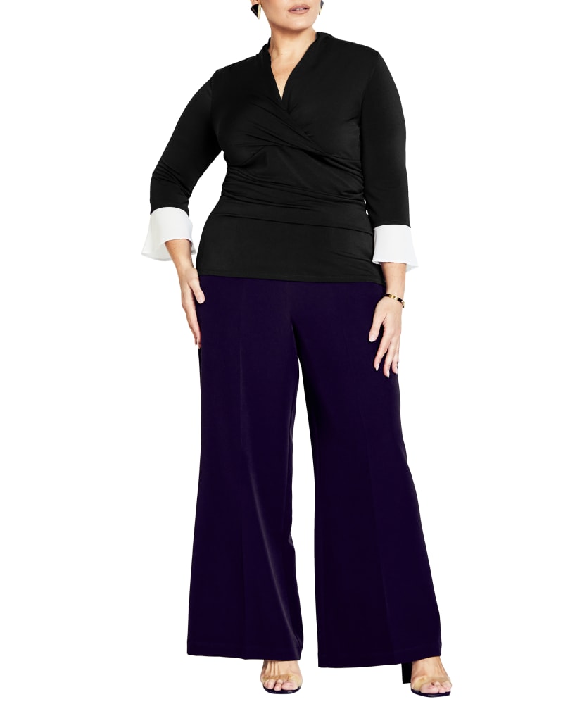 Front of a model wearing a size 20 TOP ROSELYN WRAP in Black / White by Ave Studio. | dia_product_style_image_id:302985